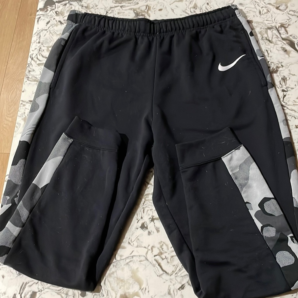 Nike men’s joggers, size large with pockets. Camo stripe along side